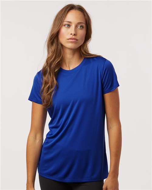 Woman wearing a blue t-shirt against a plain background